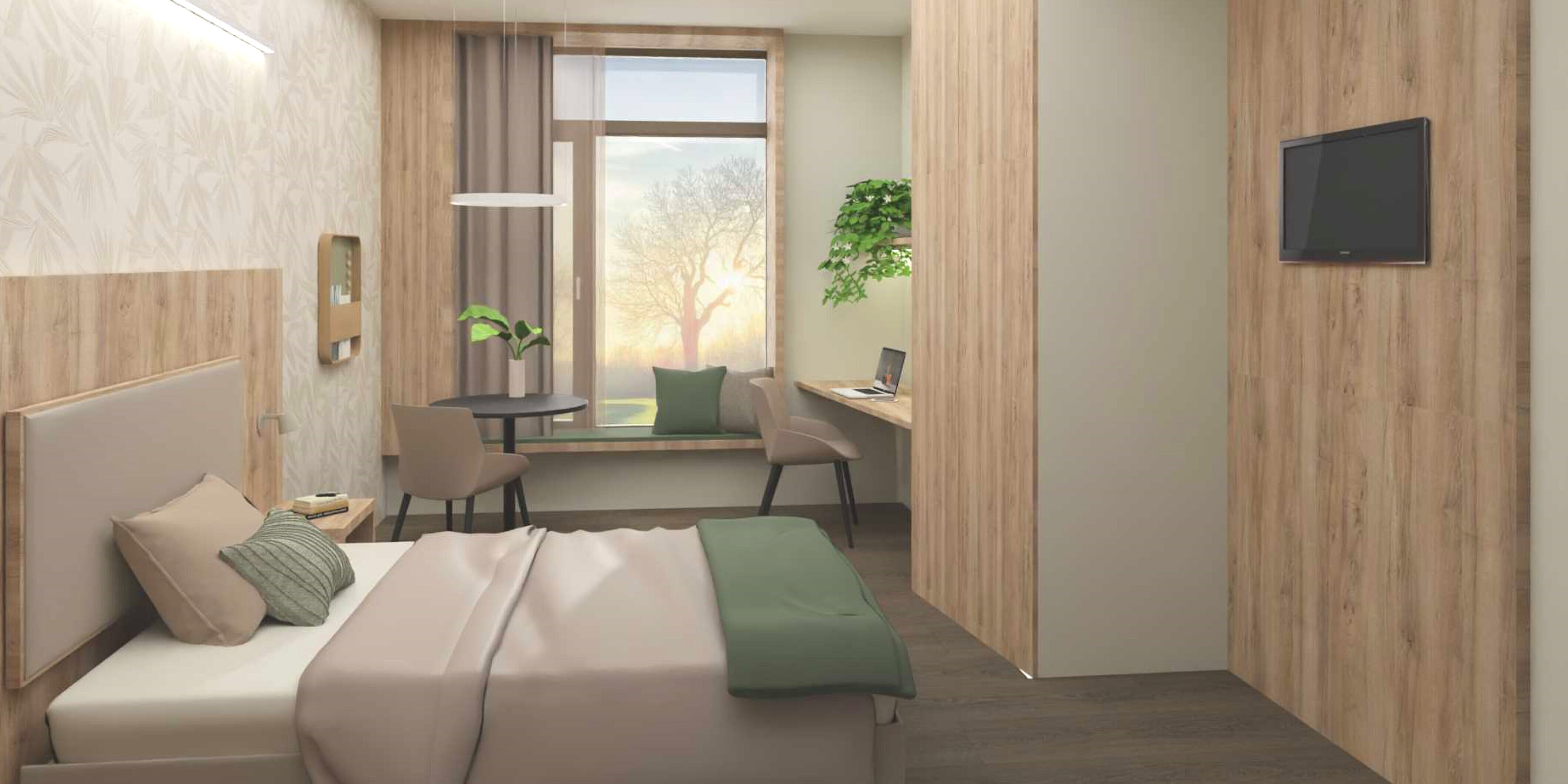 Modern eingerichtetes Einzelzimmer auf der Privatstation mit großem Bett, Schreibtisch, Fernseher